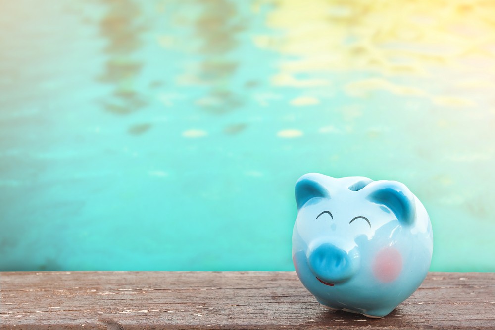 piggy bank infront of pool