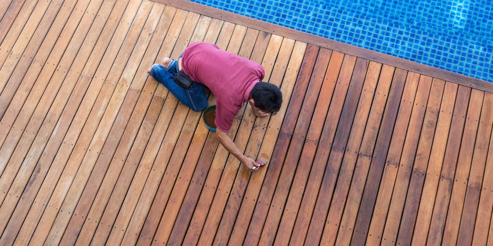 man stain a pool deck
