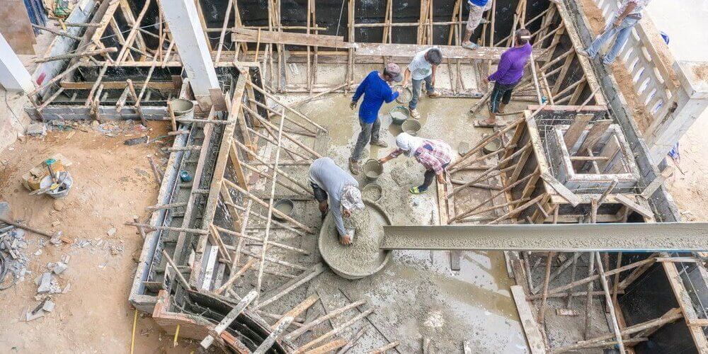 workers building a concrete pool