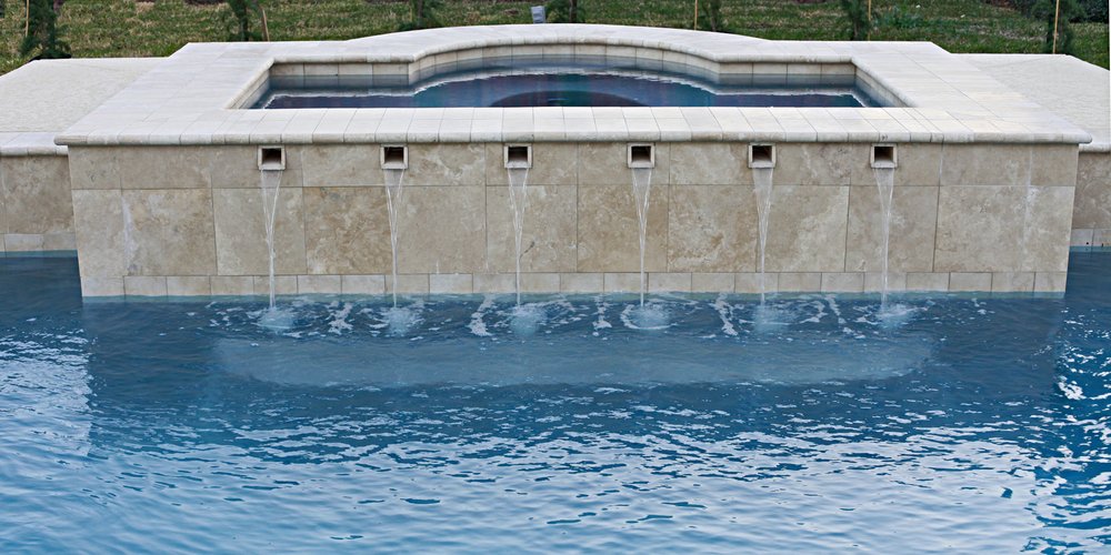 modern pool fountains create a feature between spa and pool 