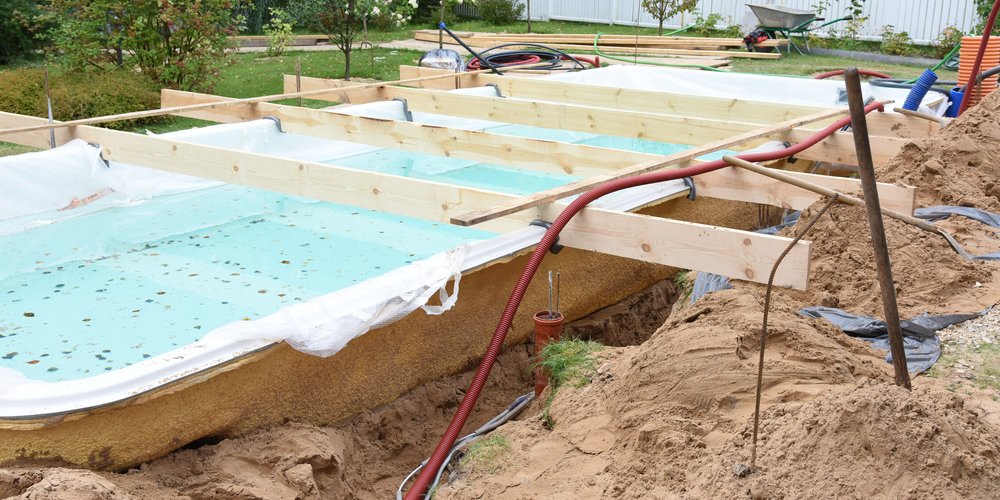 fiberglass pool being installed and made level