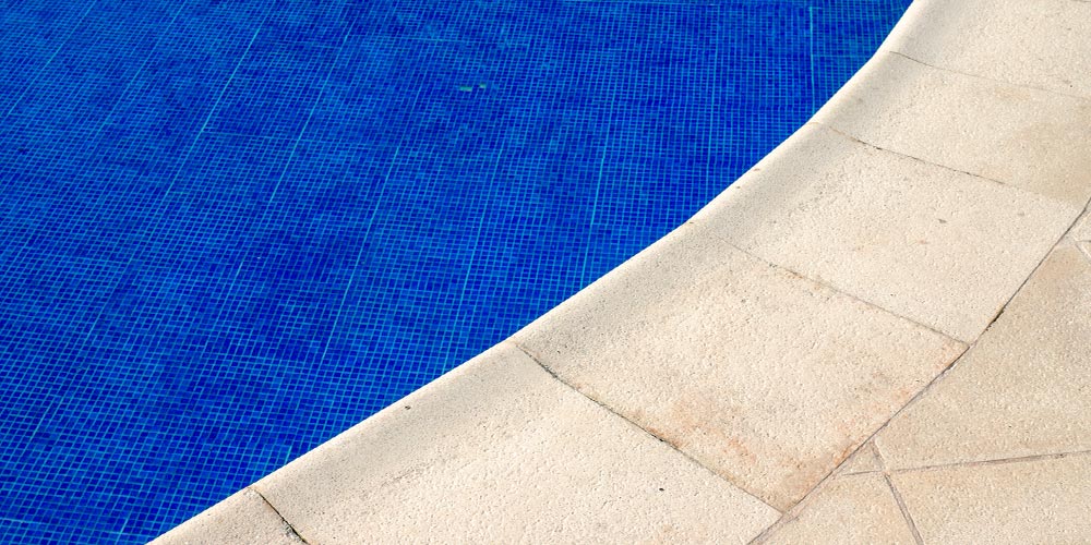 concrete pavers used as pool coping