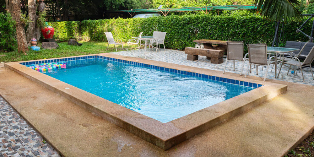 small backyard concrete pool