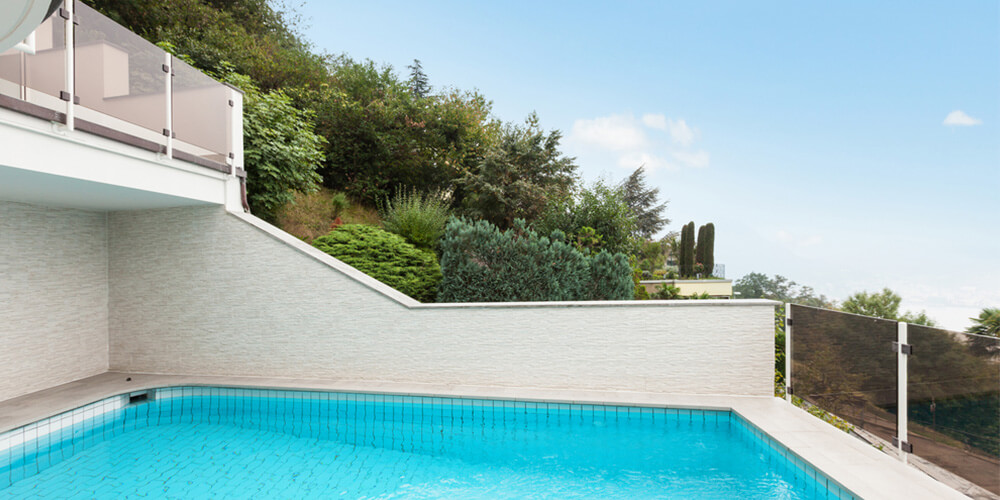 pool on a very steep slope with significant reatining walls in place