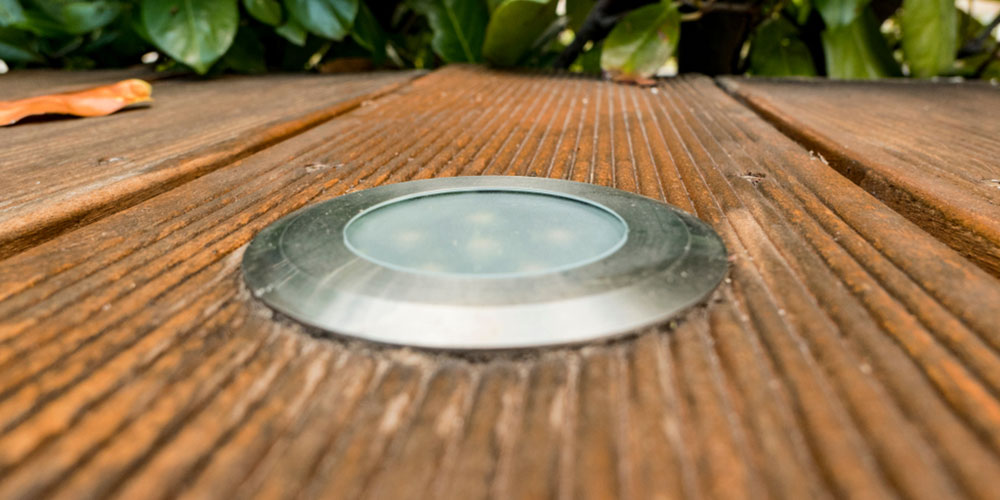 close up of a well light in a deck