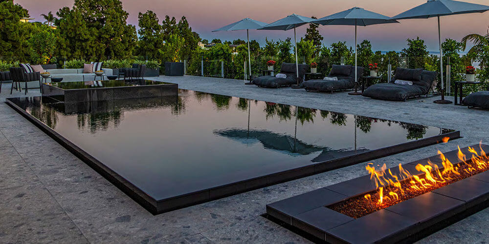 black bottom pool in a hotel with an infinity edge