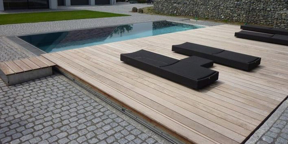 roller deck with furniture on it pulled back exposing the pool