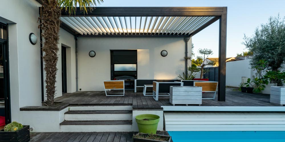 modern metal pergola on a deck next to a pool