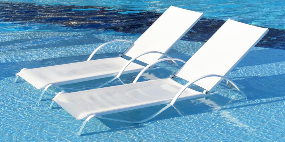 2 chaise loungers in the shallows of a pool