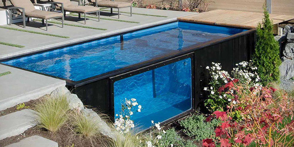 inset shipping container pool with a glass panel on the side