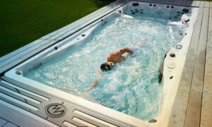 A man swimming in a hot tub.