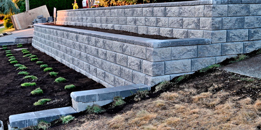 2 tier staggered retaining wall made of concrete blocks